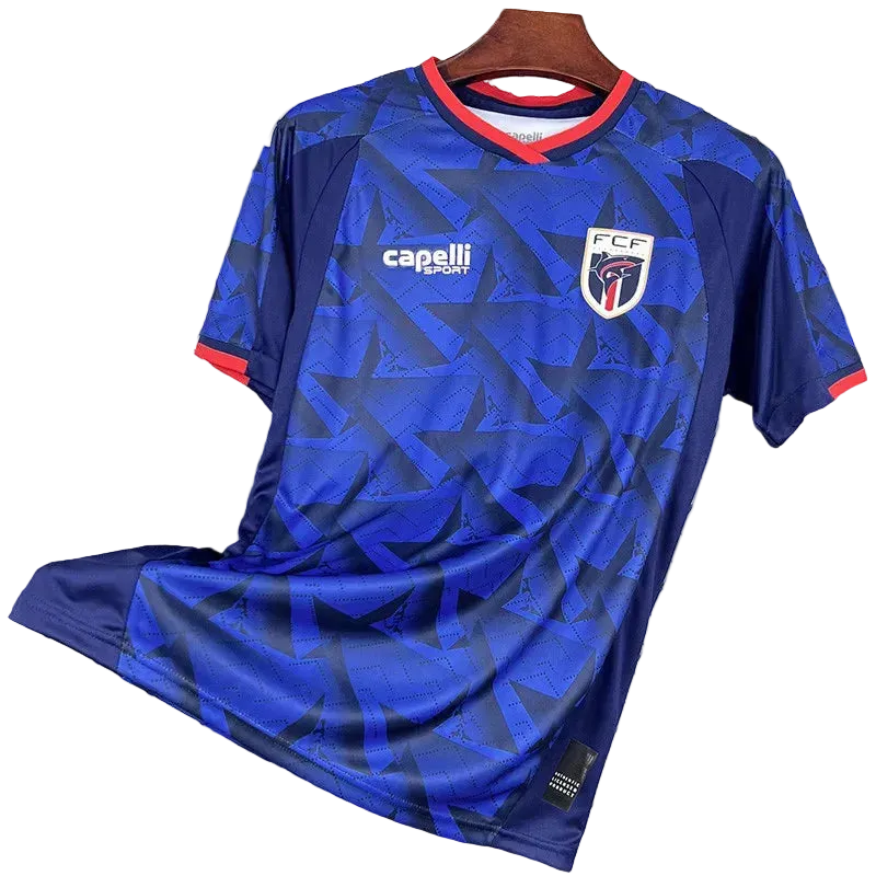 Blue sports jersey with visible branding on a hanger against a wire mesh background
